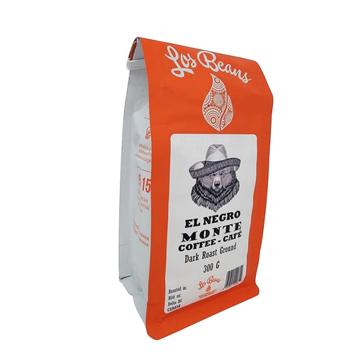 Los Beans El Negro Monte dark roast ground coffee bag with bear graphic and orange packaging.