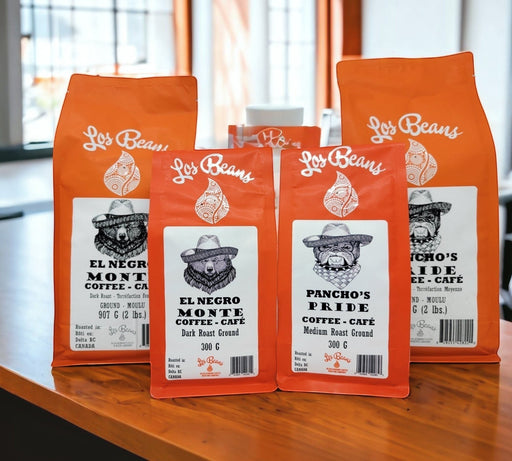 Los Beans El Negro Monte dark roast ground coffee bags, featuring a bear wearing a hat. 300g and 907g sizes.