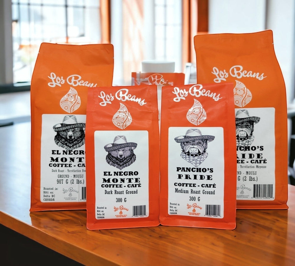 Los Beans El Negro Monte dark roast ground coffee bags, featuring a bear wearing a hat. 300g and 907g sizes.